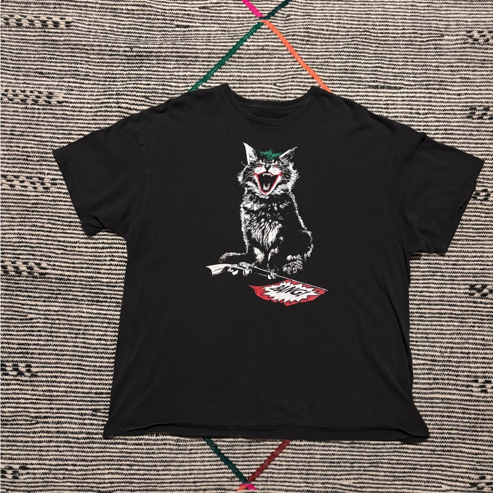 Vintage Black Graphic T-Shirt with bobcat stomping pistol Design